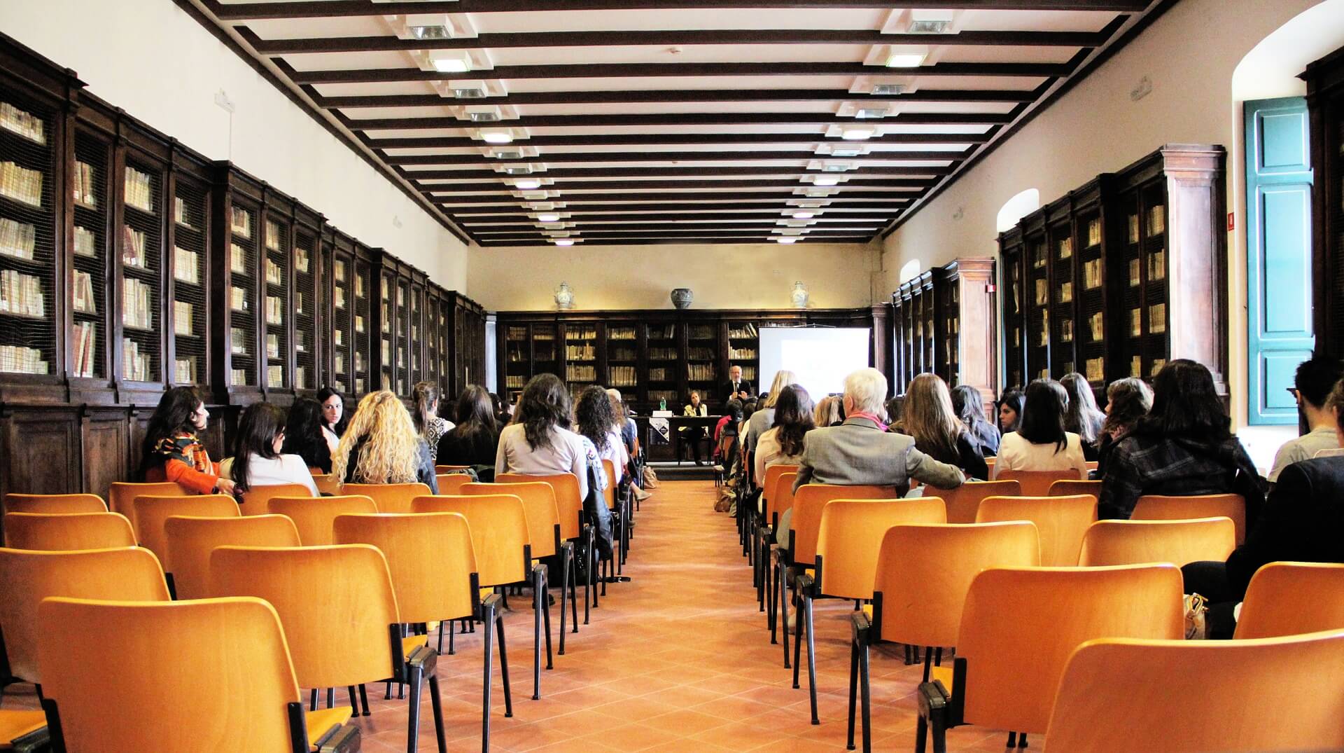 A room filled with lots of chairs and tables.